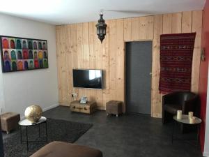 TV a/nebo společenská místnost v ubytování CosyStudio Site du Futuroscope
