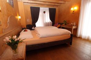 Postel nebo postele na pokoji v ubytování Bio Hotel Villa Cecilia