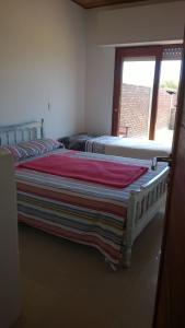 Una cama o camas en una habitación de Apartamento Lastres 27