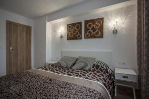 a bedroom with a bed with two pillows on it at Versus Apartment near City of Arts 2 in Valencia