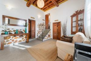 a living room with a couch and a table at Agroturismo rural Can Prats in Sant Carles de Peralta