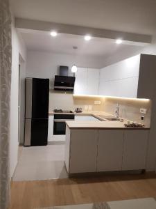 Kuchyňa alebo kuchynka v ubytovaní Apartmani Drago