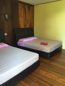 Кровать или кровати в номере Samudra Beach Chalet