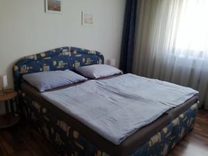 A bed or beds in a room at Apartment City-VIC
