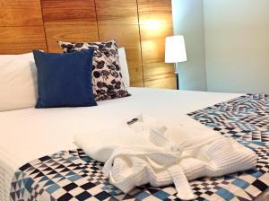Postel nebo postele na pokoji v ubytování Hotel Aladino