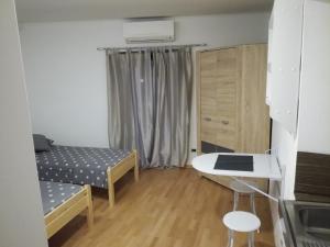 Postel nebo postele na pokoji v ubytování Guest House Kvartin