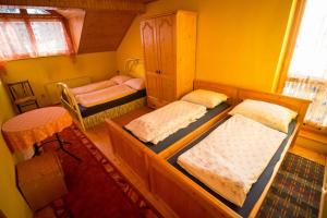 Posteľ alebo postele v izbe v ubytovaní Penzion HACIENDA