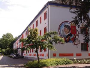 a building with a painting on the side of it at Hotel Bitburg in Bitburg