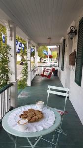 a table on a porch with cookies on it at Yamachiche P.Q. in Yamachiche