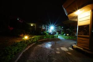 a night time picture of a house with lights at 荷村 Motel in Wuqi