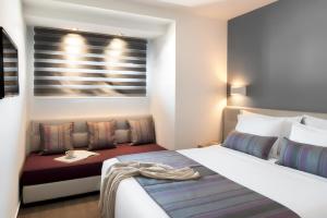Łóżko lub łóżka w pokoju w obiekcie Gkeea Boutique Hotel