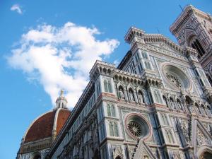 a tall building with a blue sky in the background at Relais Panoramic Cathedral Florence in Florence