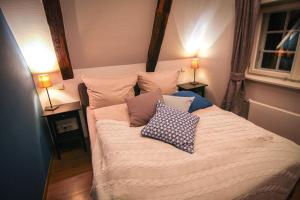 Säng eller sängar i ett rum på Gästehaus Altstadtzauber