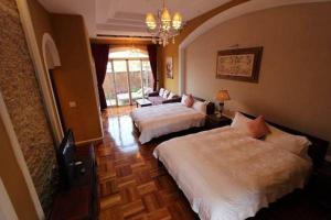 Voodi või voodid majutusasutuse My Chateau Resort toas