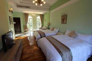 Voodi või voodid majutusasutuse My Chateau Resort toas