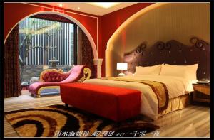 Ένα ή περισσότερα κρεβάτια σε δωμάτιο στο Yin Shui Han Motel