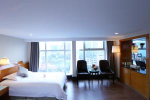 Voodi või voodid majutusasutuse Yihe Hotel Ouzhuang toas