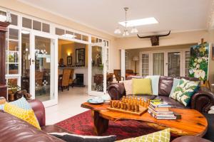 a living room with a couch and a table at Westville Bed and Breakfast in Durban