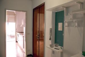 a room with a door and a table with cups on it at Naxos House in Giardini Naxos +21 photos