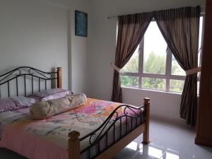 Postel nebo postele na pokoji v ubytování Sunshine Bay Resort Port Dickson