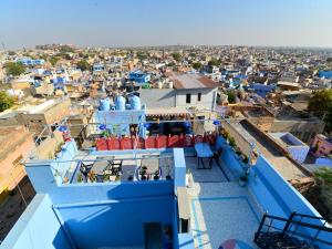 a view of the city from the roof of a building at L G Guest House in Jodhpur +37 photos
