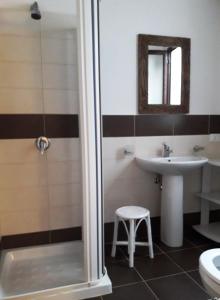 a bathroom with a shower and a sink and a toilet at Villa Lucia in Lampedusa