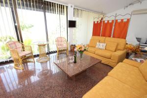 a living room with a couch and a table at Finca Alcala in Alcalá