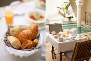 een tafel met een bord brood en een bord eten bij Riad La Villa Marrakech in Marrakesh