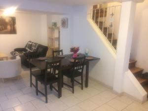 a dining room with a table and chairs and a staircase at Inobelle in Béthisy-Saint-Pierre +19 photos