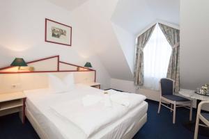 Postel nebo postele na pokoji v ubytování Hotel 3 Linden