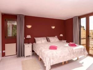 a bedroom with a large bed with pink towels on it at Villa near Montgó with Pool and Beach in Jávea +32 photos