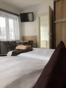 Posteľ alebo postele v izbe v ubytovaní Vila Malá Marta