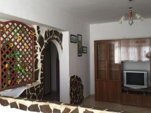 A television and/or entertainment centre at Sacca House