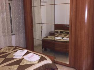 A bed or beds in a room at Sacca House