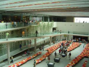 a group of people in a large building with a crowd at Full Moneda 909 in Santiago