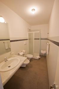 a bathroom with a sink and a toilet at B&B Casa Ruffino in Balestrate
