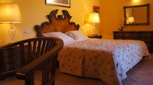 Postel nebo postele na pokoji v ubytování Petit Hotel Alaro