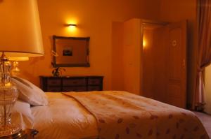 Postel nebo postele na pokoji v ubytování Petit Hotel Alaro