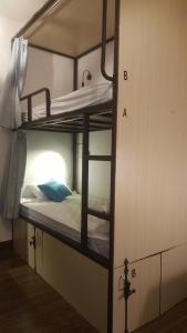 Letto o letti in una camera di Fedora Hostel