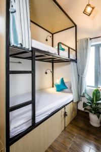 Letto o letti in una camera di Fedora Hostel