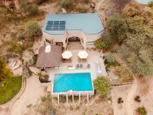 an aerial view of a house with a swimming pool at Sasa Safari Camp & Tours in Outjo