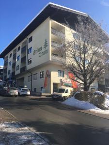 a building with a car parked in front of it at Apartment im Alpendorf in Sankt Johann im Pongau