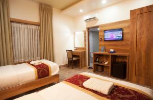 Katil atau katil-katil dalam bilik di Jungle Safari Lodge- Serenity in the Wild