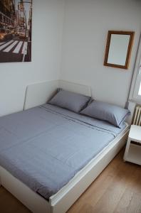 A bed or beds in a room at La Maison di Laura