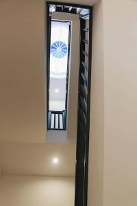 a mirror in the corner of a room with a ladder at Lost Apartments in Porto