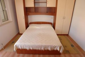Postel nebo postele na pokoji v ubytování Apartments Leontina
