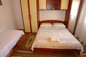 Postel nebo postele na pokoji v ubytování Apartments Leontina