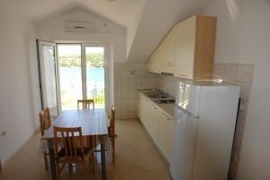 Kuchyň nebo kuchyňský kout v ubytování Apartments Leontina