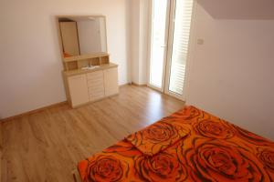 Postel nebo postele na pokoji v ubytování Apartments Leontina