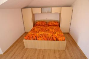 Postel nebo postele na pokoji v ubytování Apartments Leontina